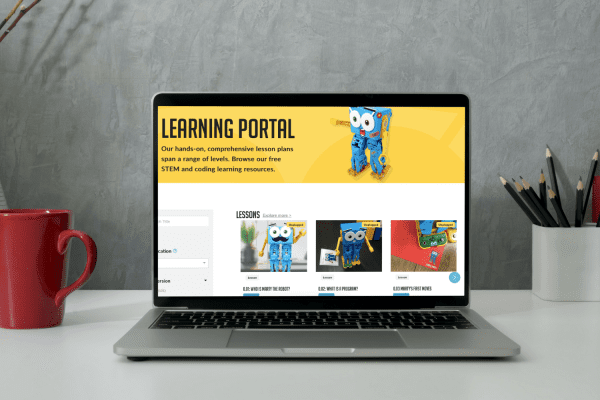 Learning Portal Open laptop with screen displaying Robotical's learning portal