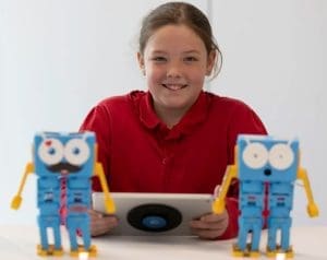 A child learning with Marty the Robot at the National Robotarium